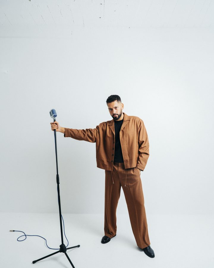 Luke Silva in the studio with a vintage microphone